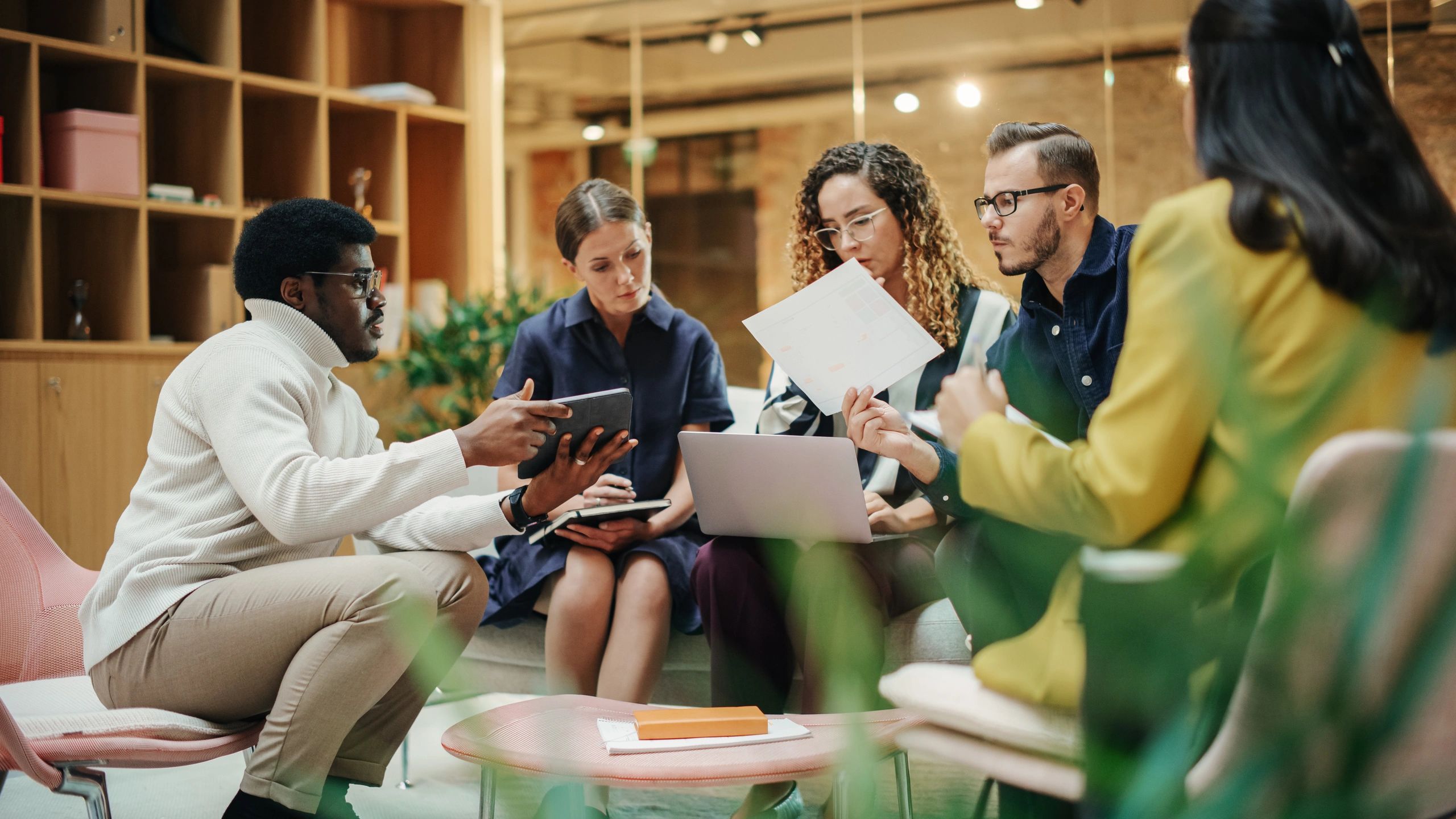 Manager leading a team discussion in a conference room