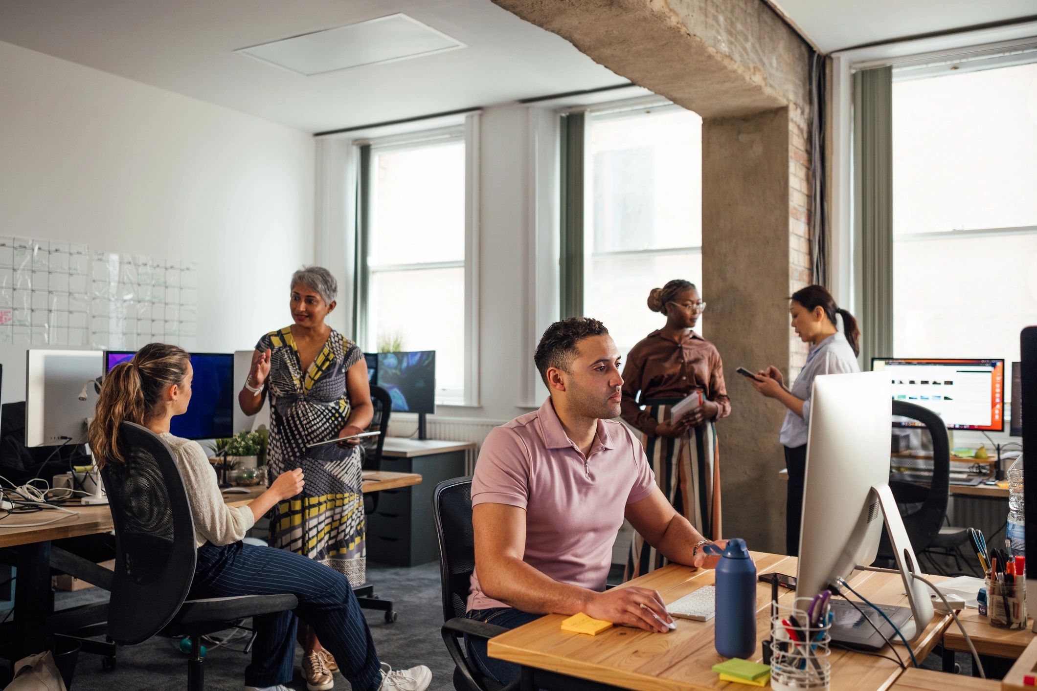 Cybersecurity consulting team working together in an office