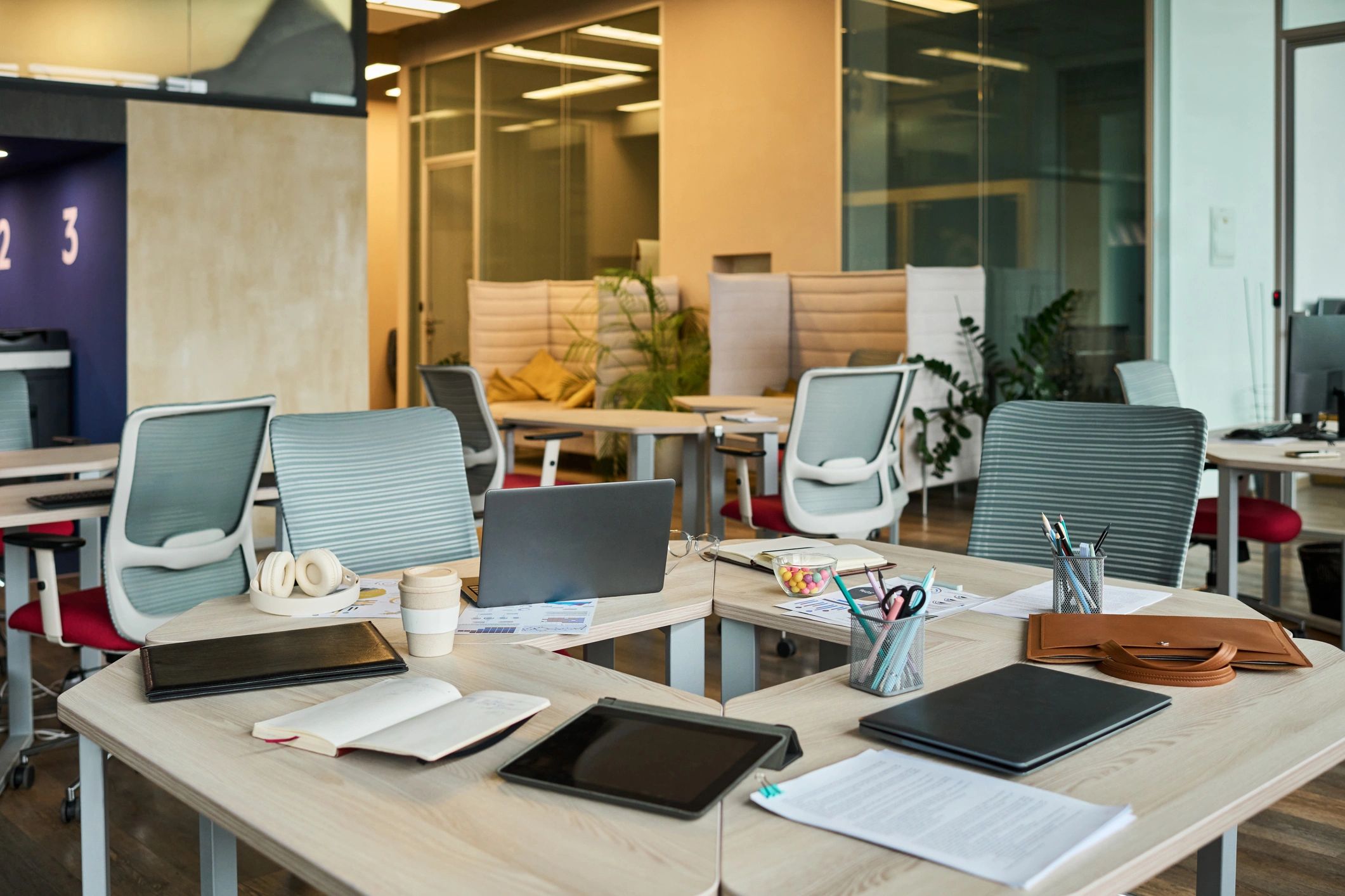 Modern workspace with laptops and planning materials